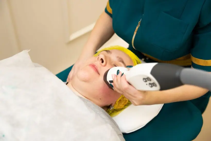Laser hair removal treatment on patient