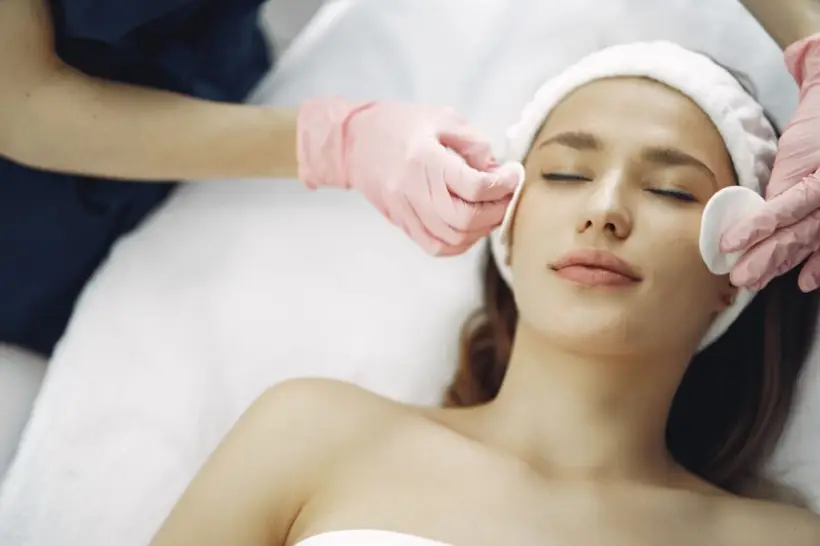 Patient receiving facial treatment for radiant skin