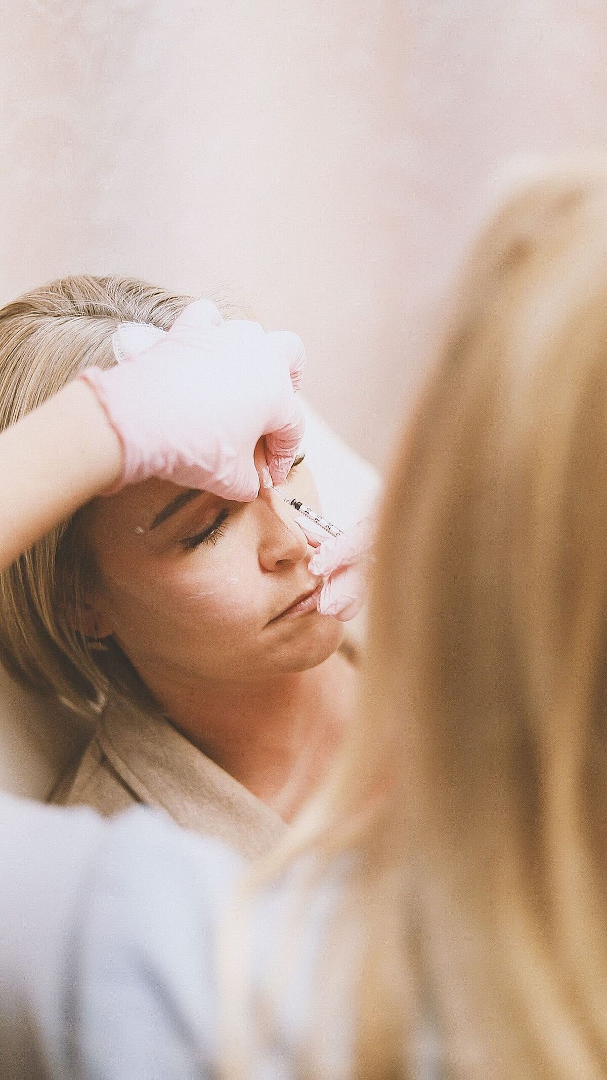 Non-surgical rhinoplasty filler treatment being performed in Maldives