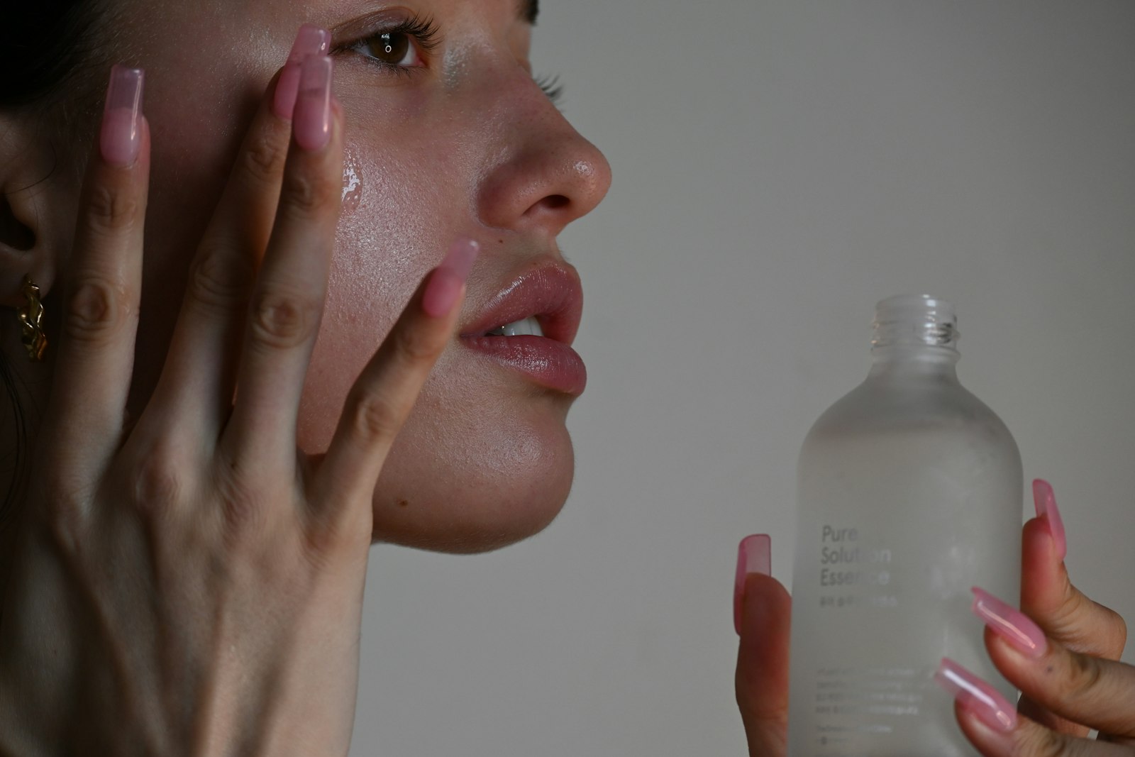 Patient applying gentle skincare as part of Profhilo aftercare between treatment sessions
