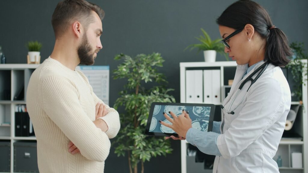 A doctor reviewing skin assessment results with a patient during a consultation - Dr. Alaa Zidan, Maldives
